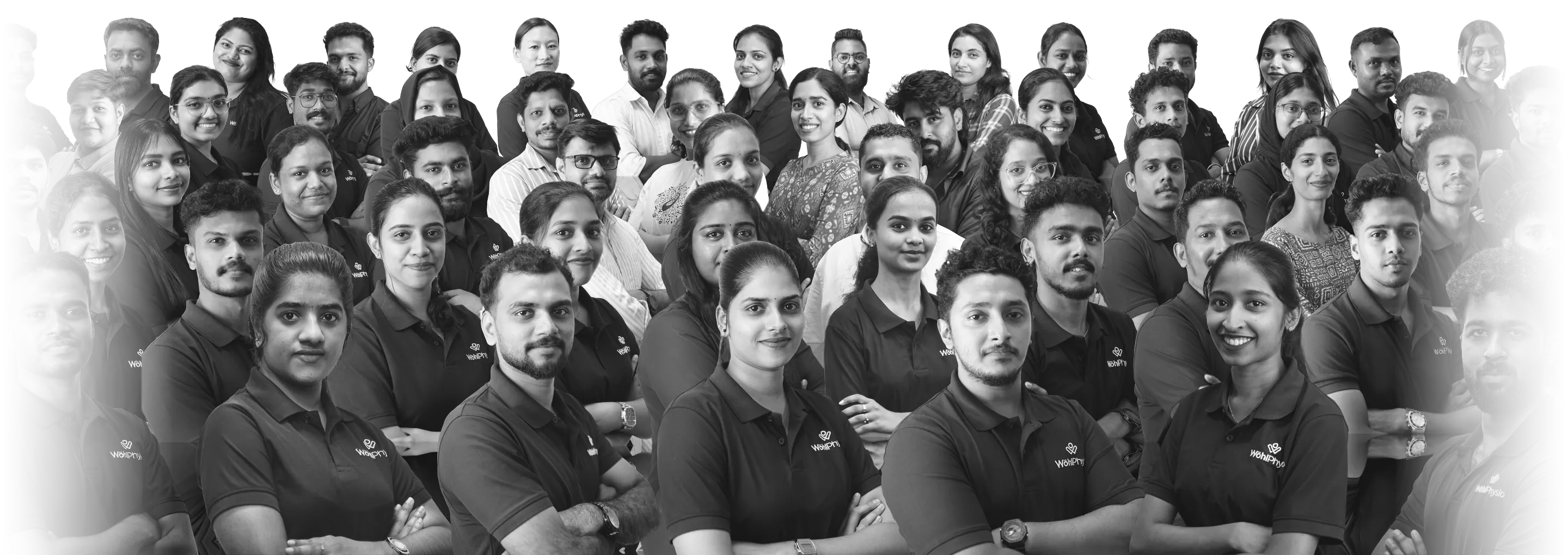 Wohl Physio physiotherapists and staff gathered together, in black and white.